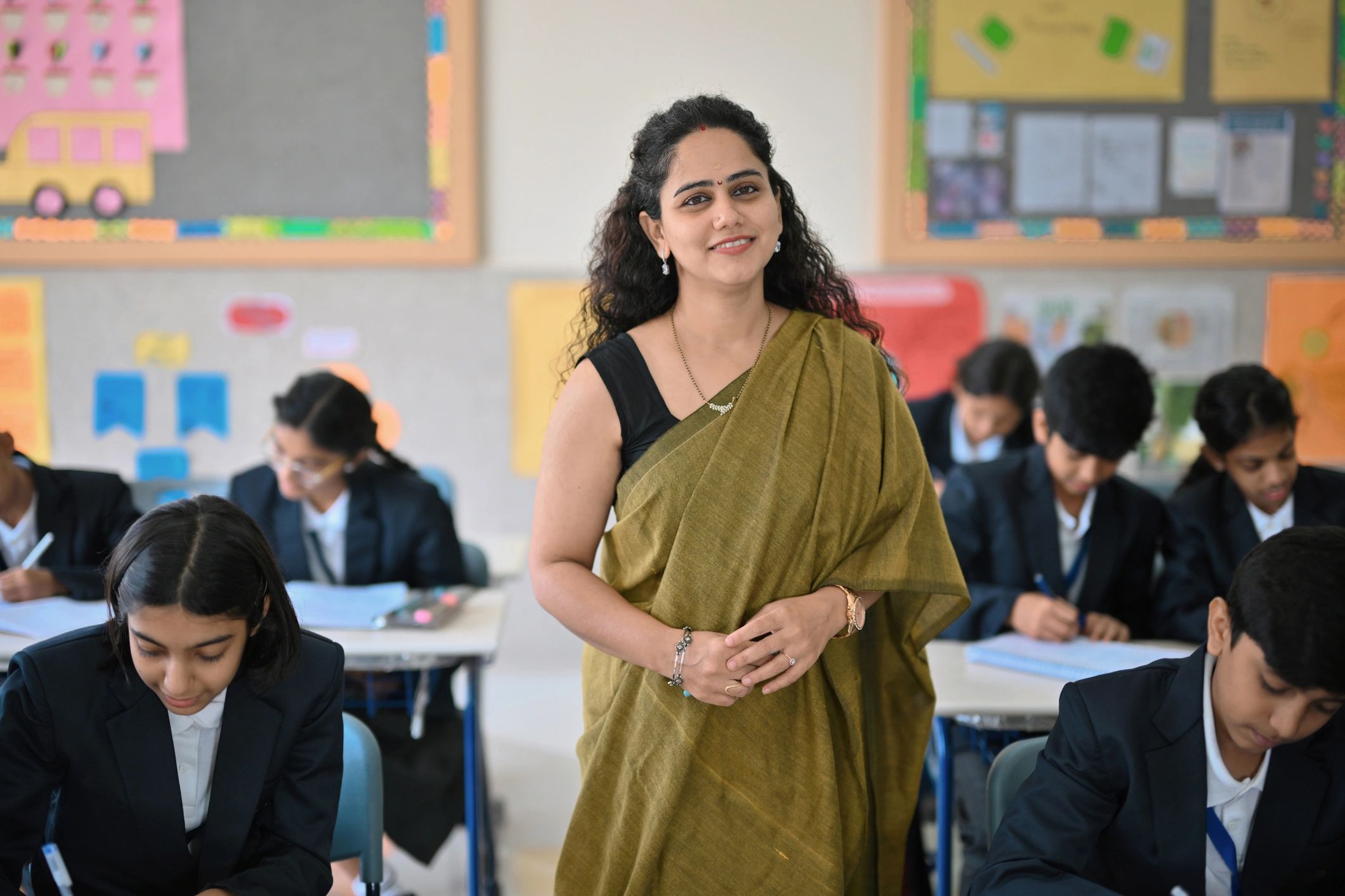 happy teacher with students India